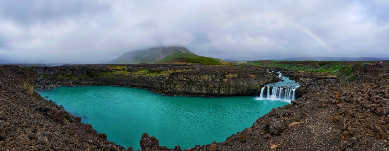 Icelandic landscape with waterfall